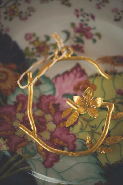 Gold letter G branch ornament with flower