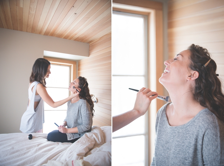 bride and sister getting ready in a cabin