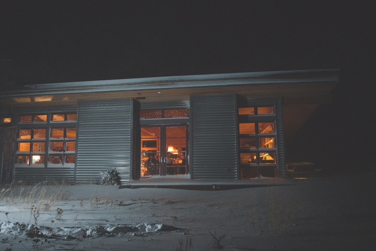 Silverthorne cabin windows lit up at night